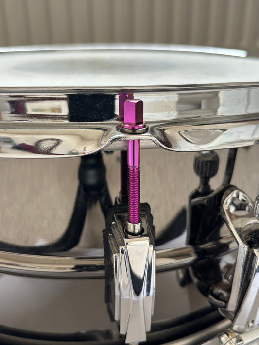 Custom titanium tension rod on snare drum