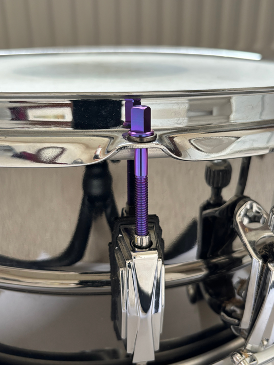 Custom titanium tension rod on snare drum