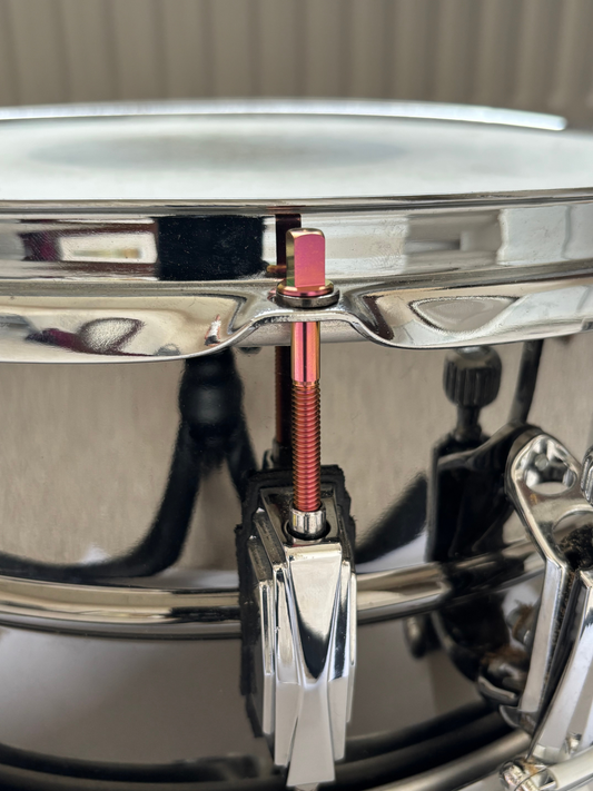 Custom titanium tension rod on snare drum