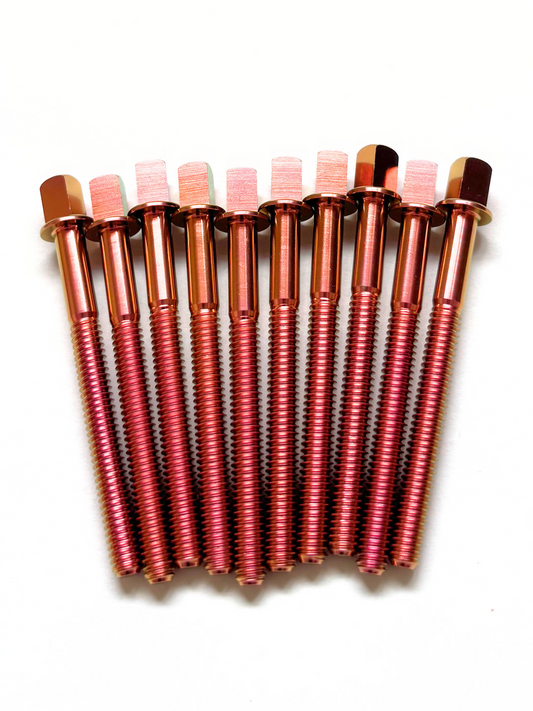 Set of colourful titanium drum tension rods on white background